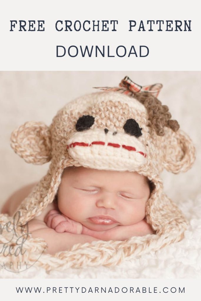 Sleeping baby in a crocheted sock monkey hat with big ears, red mouth, black eyes; text: Free crochet sock monkey hat pattern download. Free crochet pattern