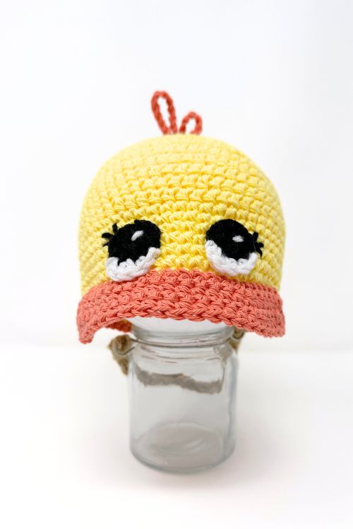 yellow and orange crochet duck cap with big eyes