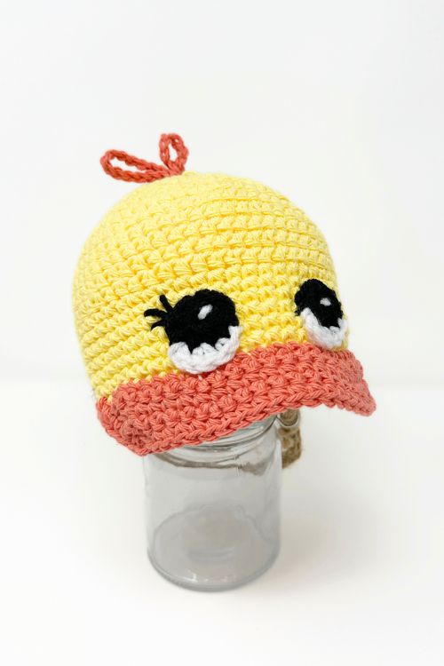 yellow and orange crochet duck cap with big eyes