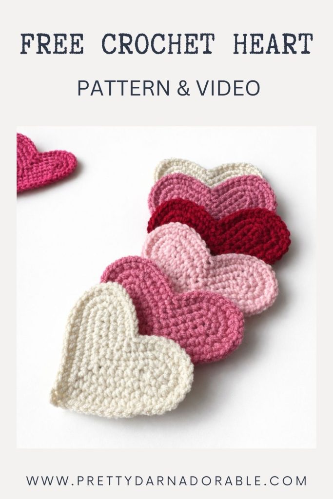 Five crochet hearts in white, pink, red, and burgundy on a white background. Text: HOW TO CROCHET A HEART—Free Pattern & Video. Free crochet pattern
