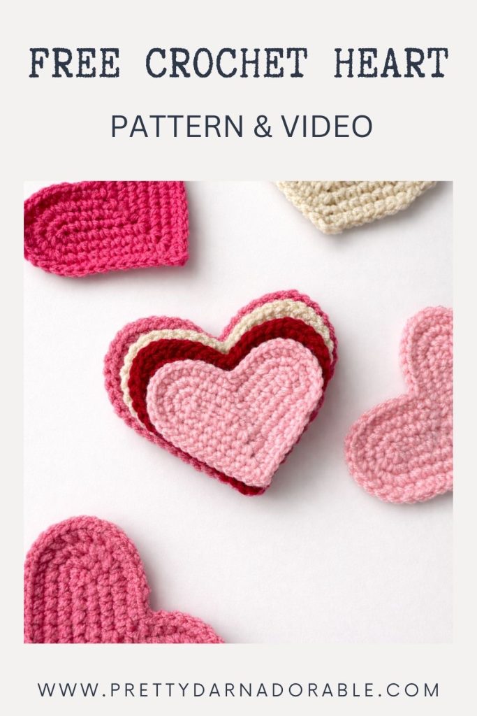 Crocheted hearts in pink, red, and cream on white background; text says HOW TO CROCHET A HEART with a website link below. Free crochet pattern