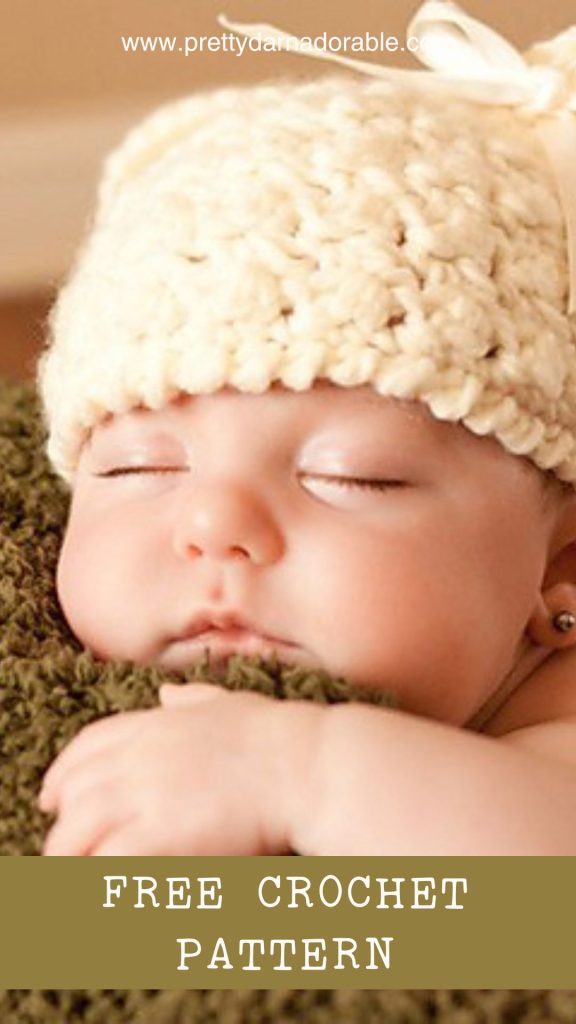 baby wearing a crochet bear hat with bow