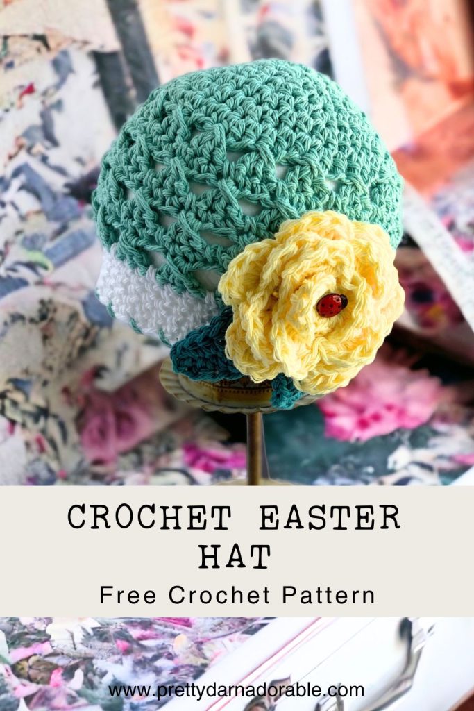 aqua crochet beanie with white trim and rose on a baby. free crochet baby hat pattern