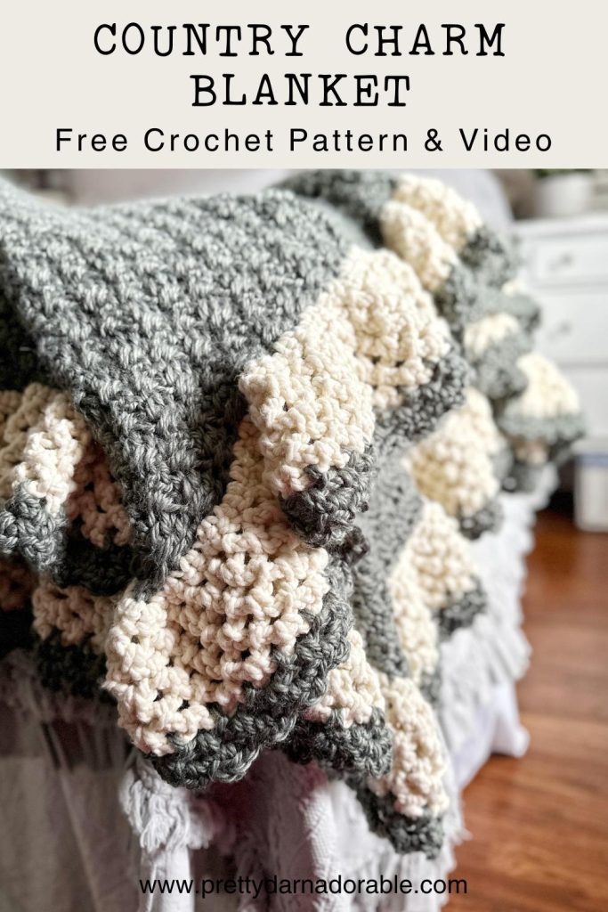 green crochet blanket with cream scalloped border
