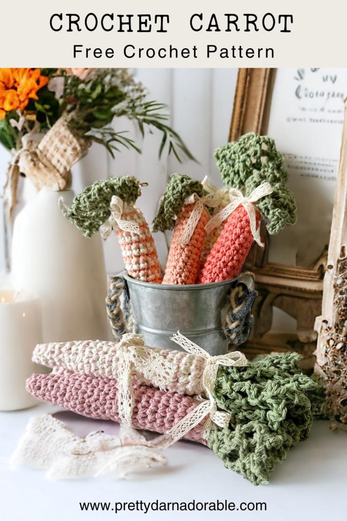 group of crochet carrots with green tops in solid and stripes with cotton yarn on the side
