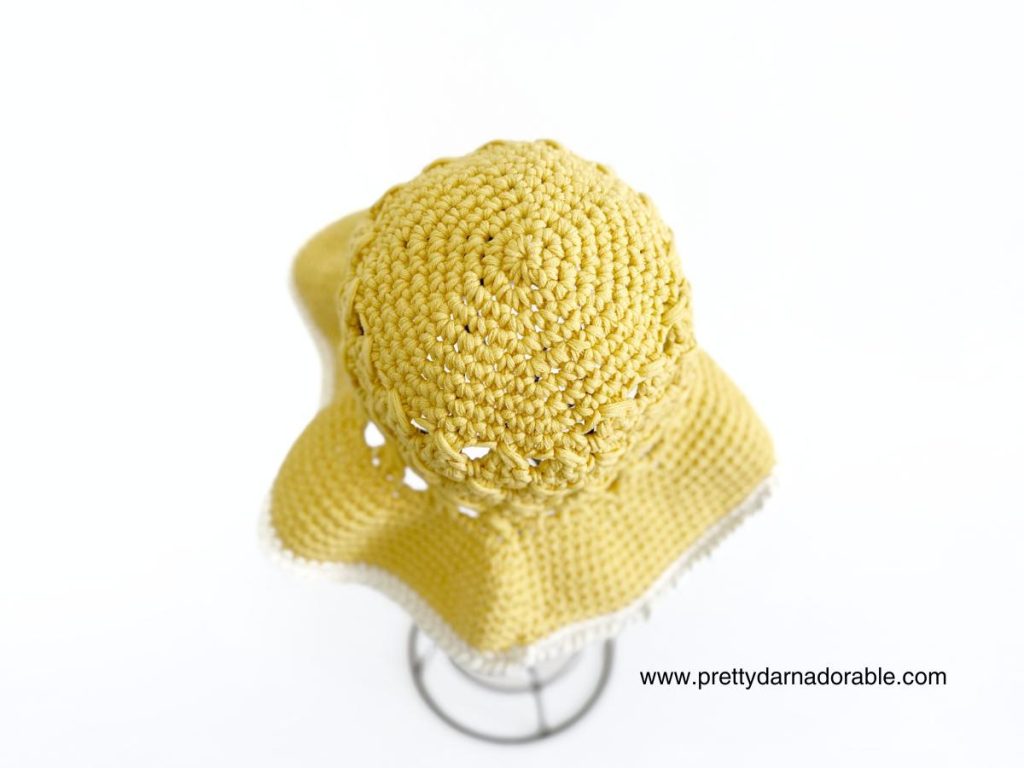 childs crochet sun hat made in yellow cotton with cream trim