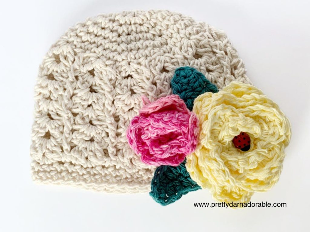 cotton crochet beanie with crochet flowers and leaves