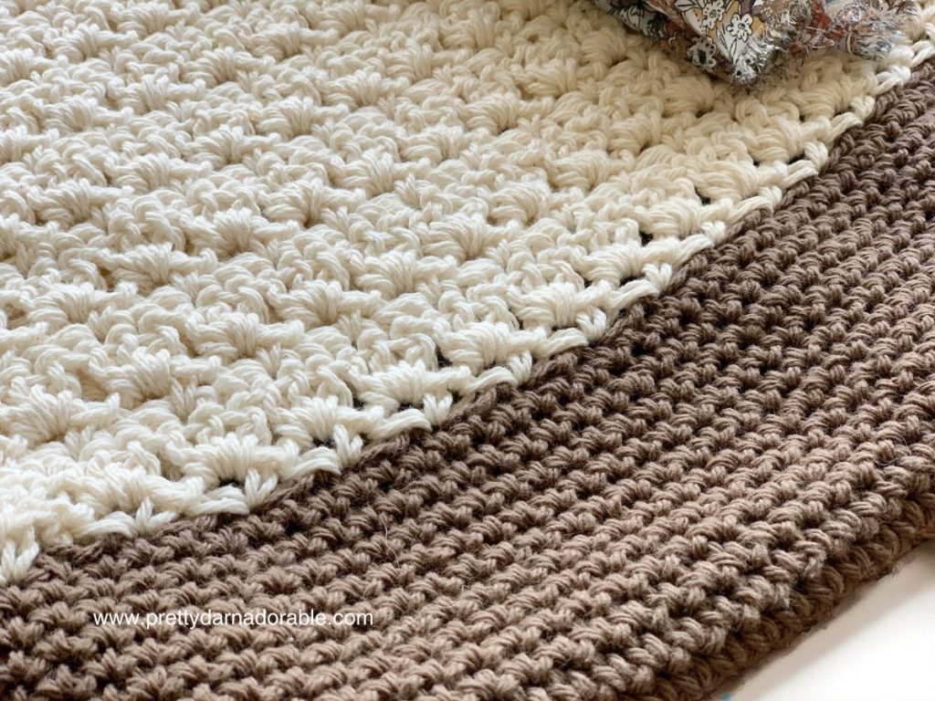 Cream crochet tote bag with brown bottom and round wooden handles