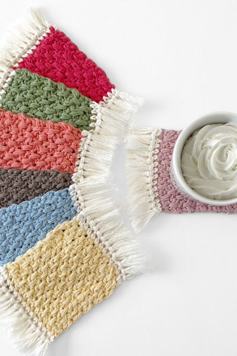 multiple coloured crochet mug rugs with fringe