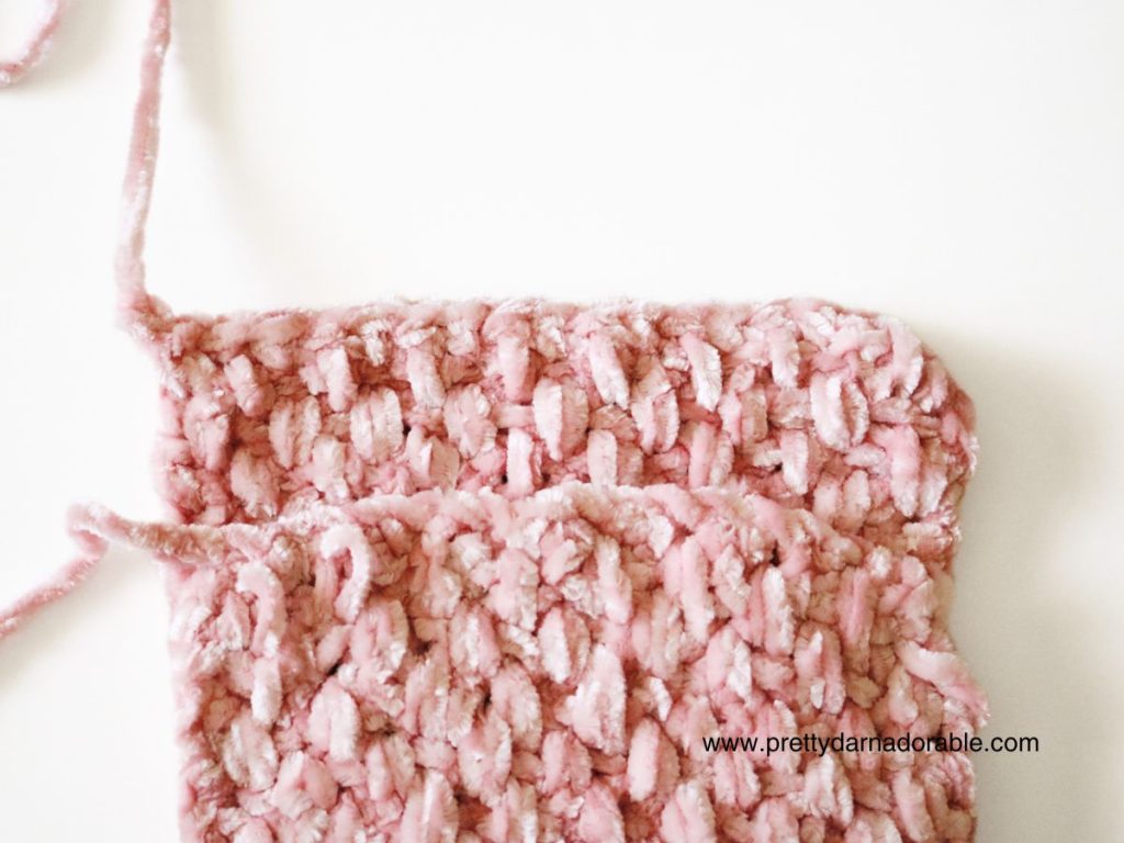 a close up of a pink crocheted headband ends