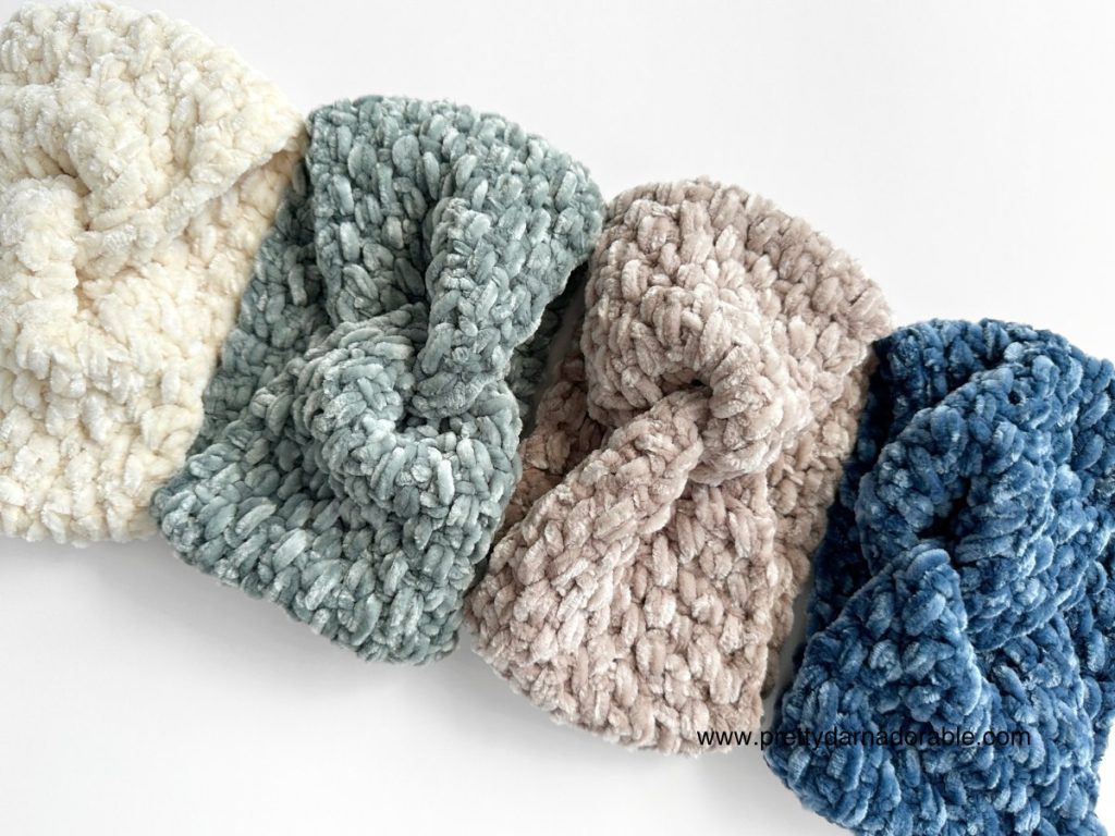 three crochet velvet twisted headbands on a white surface