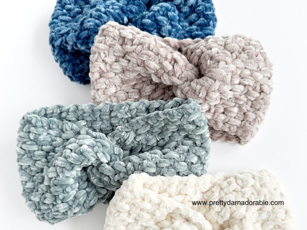 three crochet velvet twisted headbands on a white surface