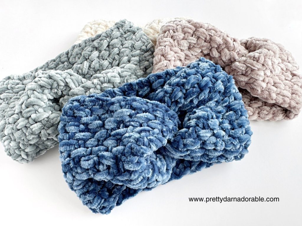 three crochet velvet twisted headbands on a white surface