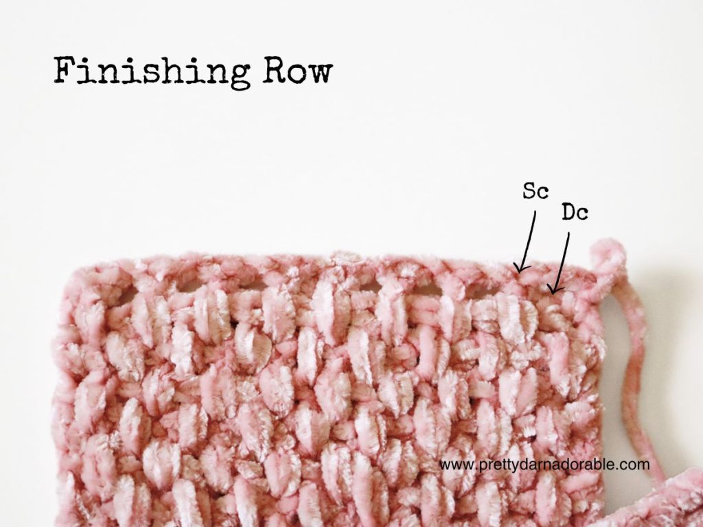 a close up of a pink crocheted headband ends
