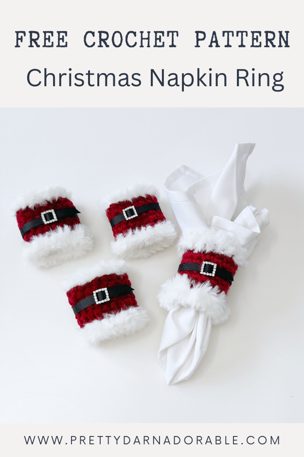 red napkin ring with white fur trim with black belt and rhinestone buckle