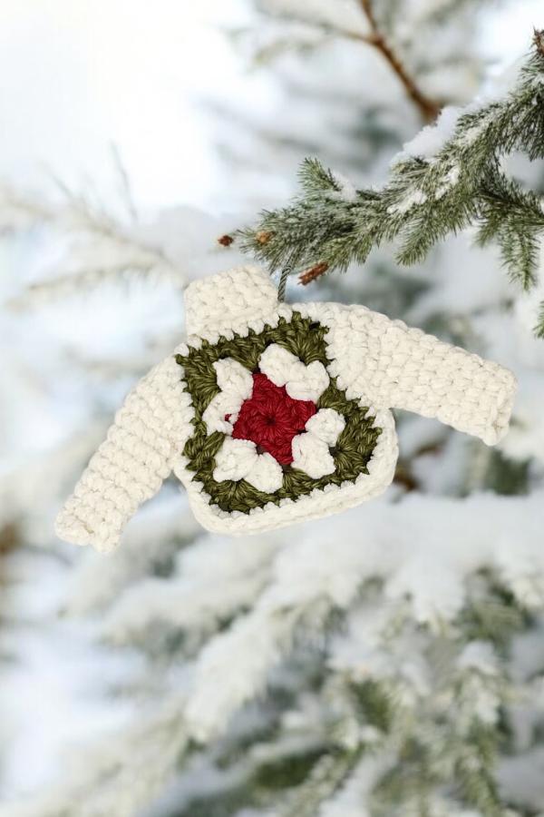 crochet granny square ornament hanging from a tree branch