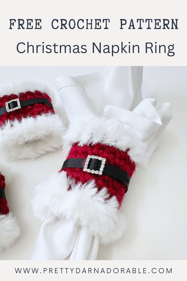 red napkin ring with white fur trim with black belt and rhinestone buckle