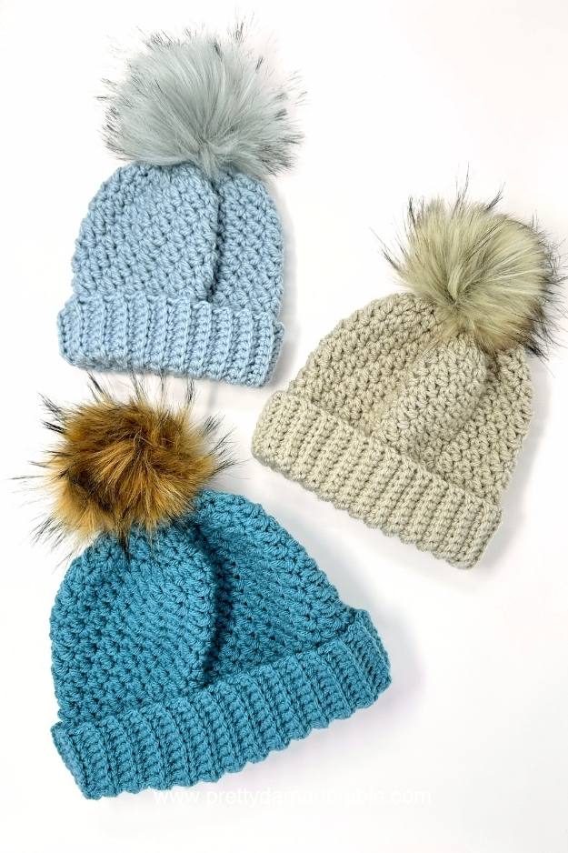 three textured beanie with pompoms and folded ribbed brim