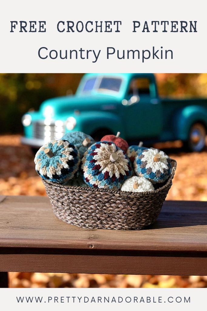 a basket filled with crocheted pumpkins and yarn
