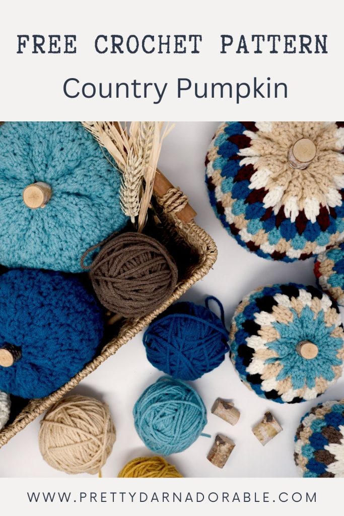 a basket filled with crocheted pumpkins and yarn