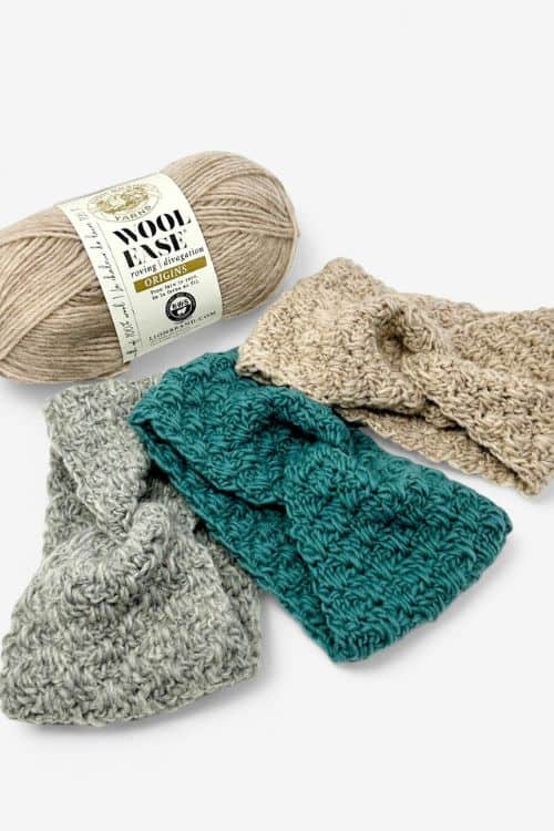 A beige yarn skein lies beside three textured crochet headbands in beige, teal, and gray on a white background; the image promotes free crochet headband patterns for women. Free crochet pattern