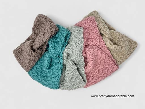 Five textured, crocheted headbands in brown, teal, gray, pink, and beige are fanned on white; www.prettydarnadorable.com in corner. Free crochet pattern
