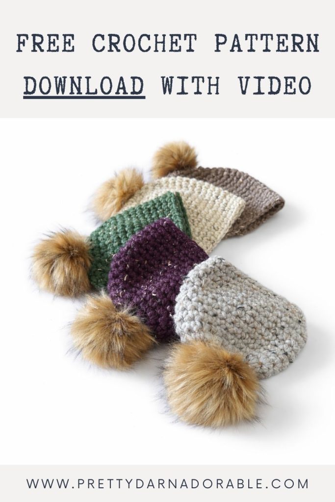Four crocheted hats—green, cream, purple, and gray—with faux fur pom-poms on a white surface. Text offers free pattern with video. Free crochet pattern