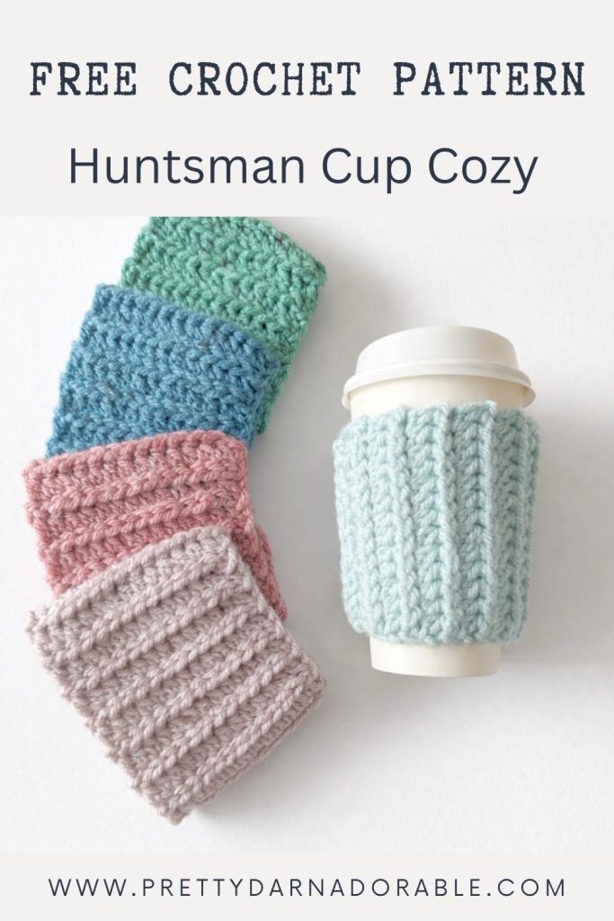 Pastel crocheted cup cozies sit beside a takeaway cup with a blue cozy; text reads "Free Crochet Pattern Huntsman Cup Cozy. Free crochet pattern