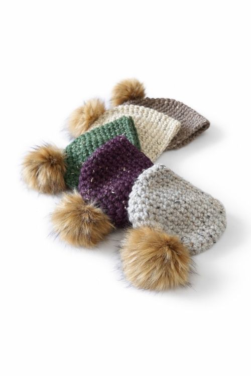 Four hats in beige, green, purple, and grey with large brown pom-poms overlap on a white background; no text visible. Free crochet pattern
