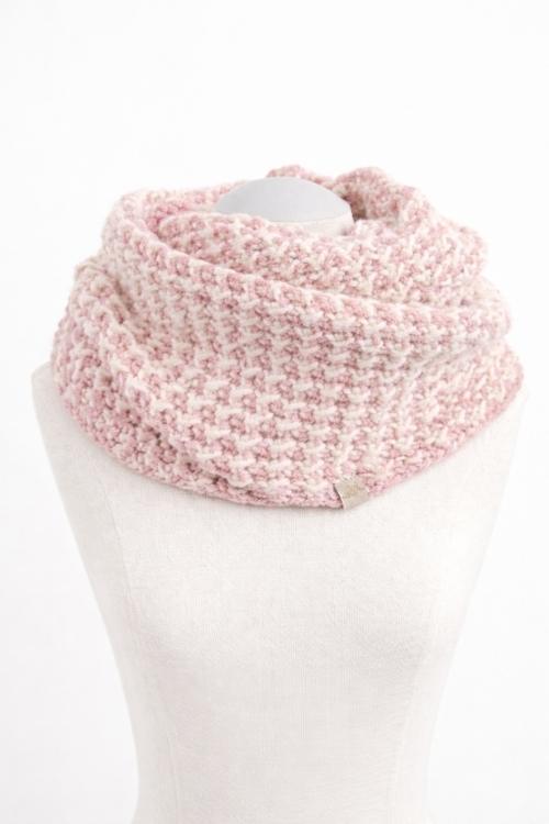 A pale pink, textured infinity scarf drapes around a white mannequin torso on a plain white background. Free crochet pattern