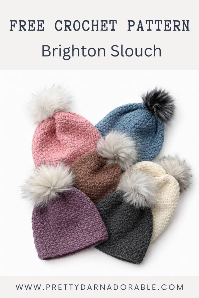 Five slouch hats in pink, blue, brown, cream, and gray with pom-poms. Text: Free Crochet Pattern Brighton Slouch. prettydarnadorable.com. Free crochet pattern