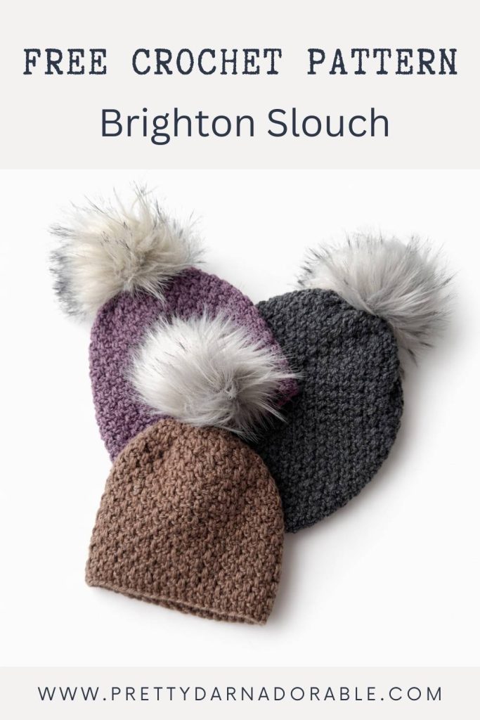 Three crocheted slouchy hats in purple, gray, and brown with faux fur pom-poms on a white background. Text: Free Crochet Pattern Brighton Slouch. Free crochet pattern