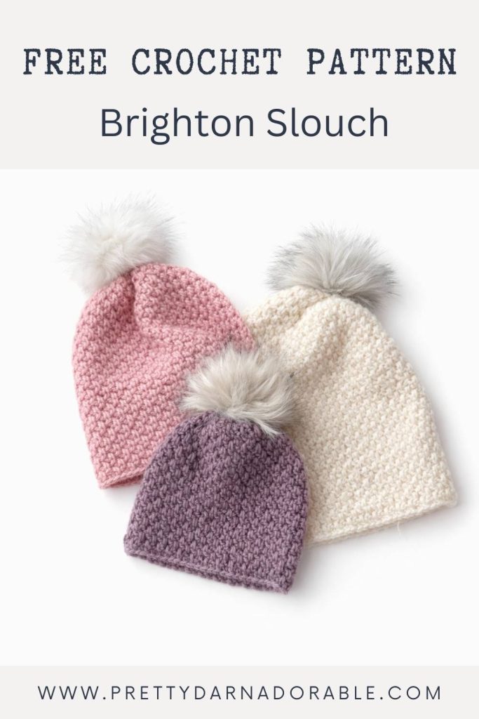 Three crocheted slouch hats in pink, cream, and lavender with pom-poms on a white background. Text: Free Crochet Pattern Brighton Slouch. Free crochet pattern