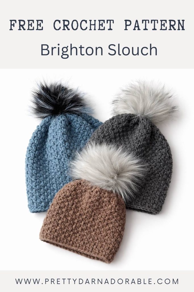Three crochet slouch hats in blue, gray, and brown with faux fur pom-poms on white. Text: Free Crochet Pattern Brighton Slouch, www.prettydarnadorable.com. Free crochet pattern