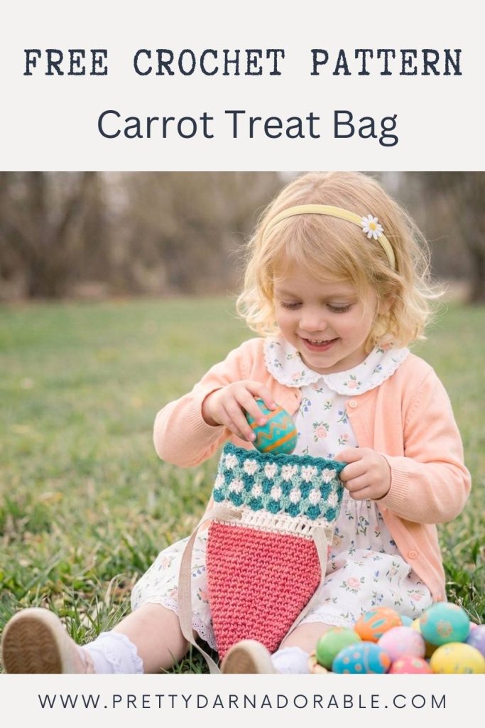 Young girl in peach cardigan, white dress, on grass, puts Easter egg in crochet carrot bag; text: “Free Crochet Carrot Treat Bag Pattern.”. Free crochet pattern