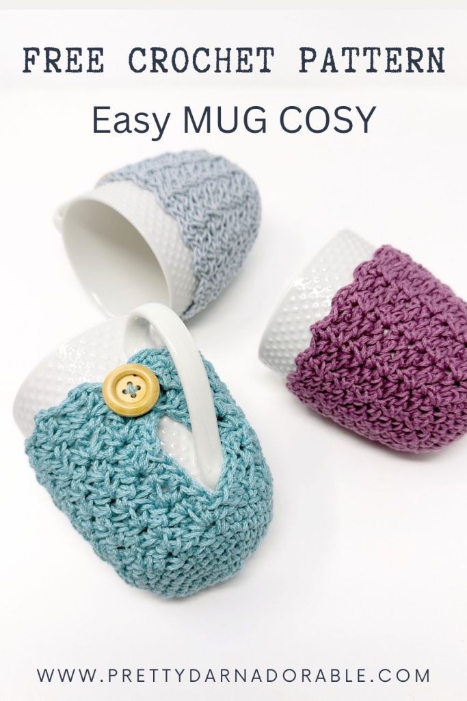 Three white mugs with grey, purple, and teal crocheted cozies on a white background. Text: “Free Crochet Mug Cozy Pattern - Easy Mug Cosy.”. Free crochet pattern