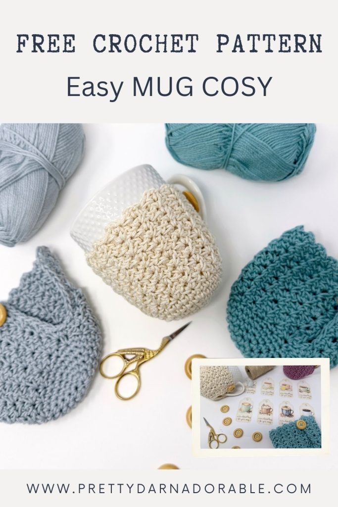 Cream mug cozy on white mug, with blue and grey yarn, gold buttons, scissors, crochet pieces; text: FREE CROCHET MUG COZY PATTERN – Easy MUG COSY. Free crochet pattern