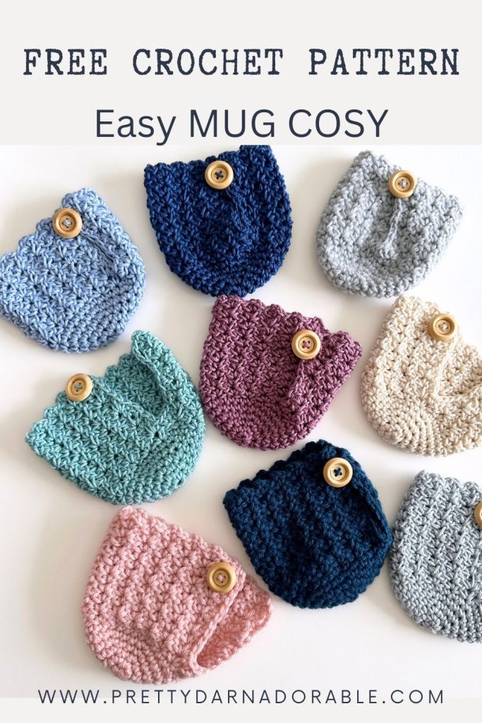 Colorful crocheted mug cozies with wooden buttons are shown on a white background. Text reads: Free Crochet Mug Cozy Pattern - Easy Mug Cosy. Free crochet pattern